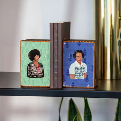 wooden bookends with feminists and quotes on them