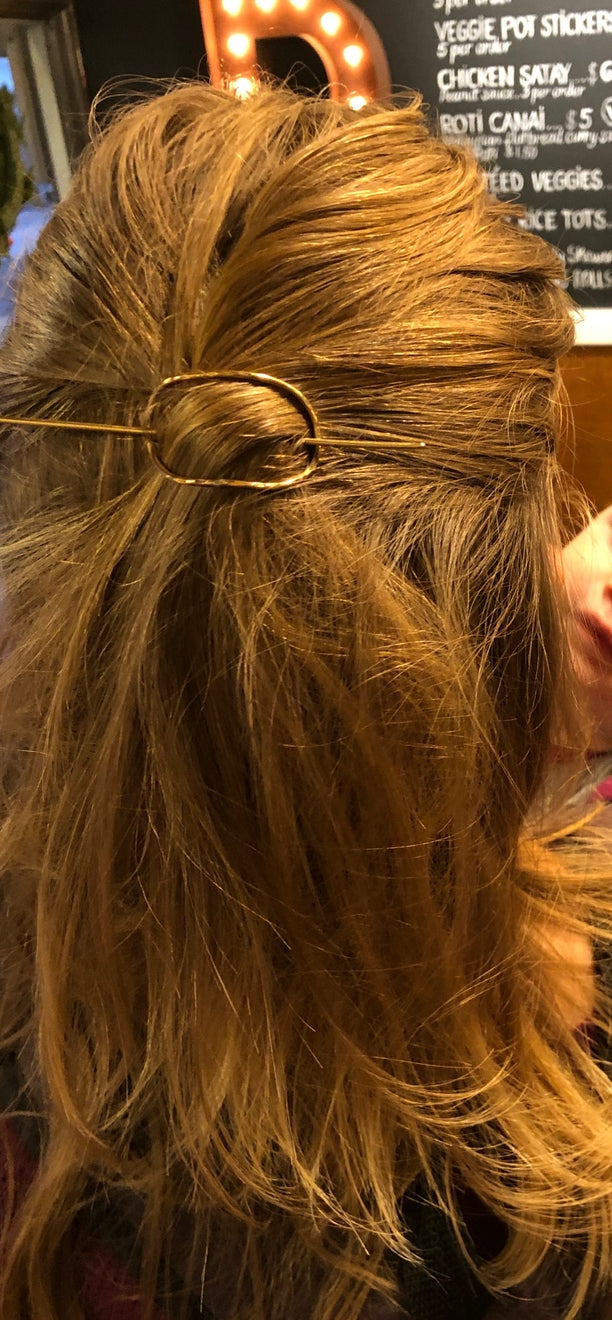 brass hair pin on a model