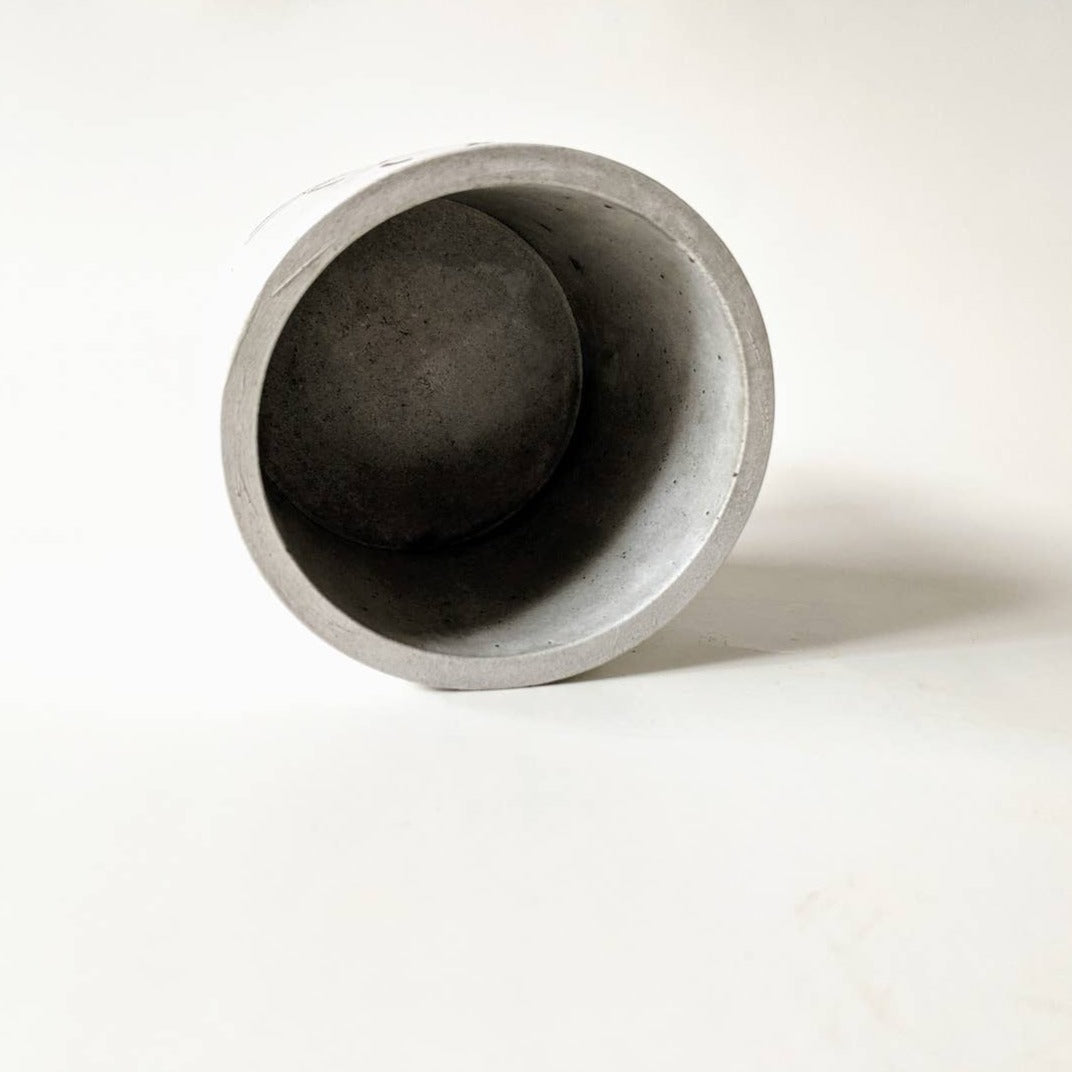 Interior of the concrete planter; empty and hollow