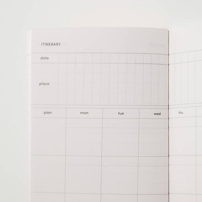 Sample interior page of travel journal showing itinerary with prompts for dates, places, and plans and a calendar grid view