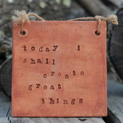clay tile with text: "today i shall create great things"