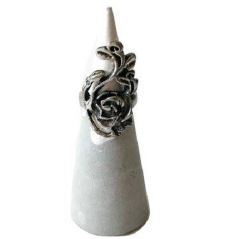 Concrete ring cone dipped in silver paint at the top; holding a ring