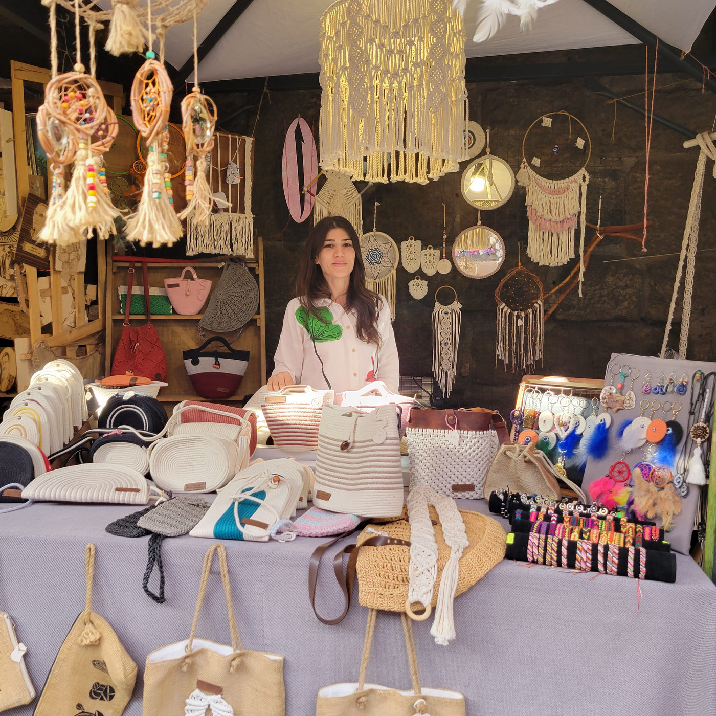 Artist, Elif, in her shop with macrame accessories