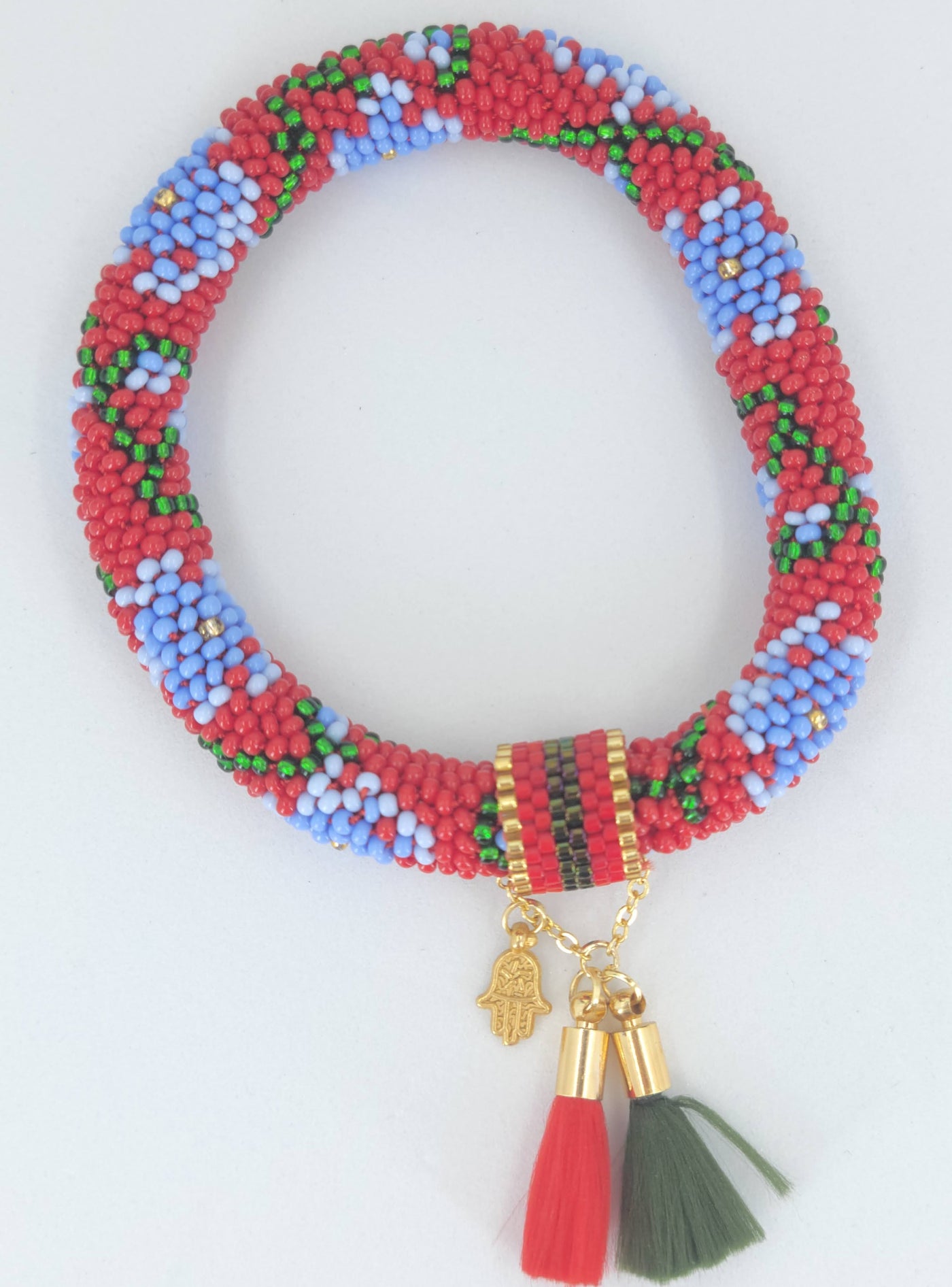 crocheted beaded bracelet in floral with tassels and hamsa charm