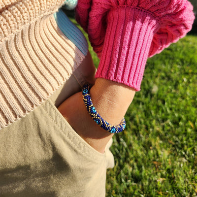 crocheted beaded bracelet with evil eyes on a model