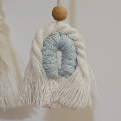 detail of macrame mobile for baby crib
