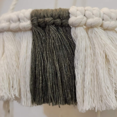 close up of macrame baby crib mobile