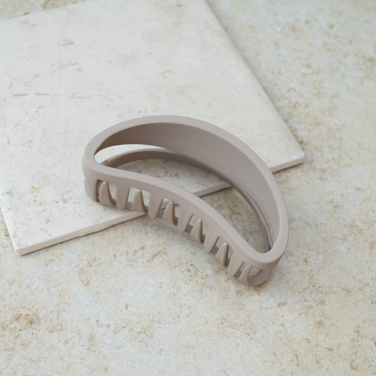 bean shaped claw clip in khaki color