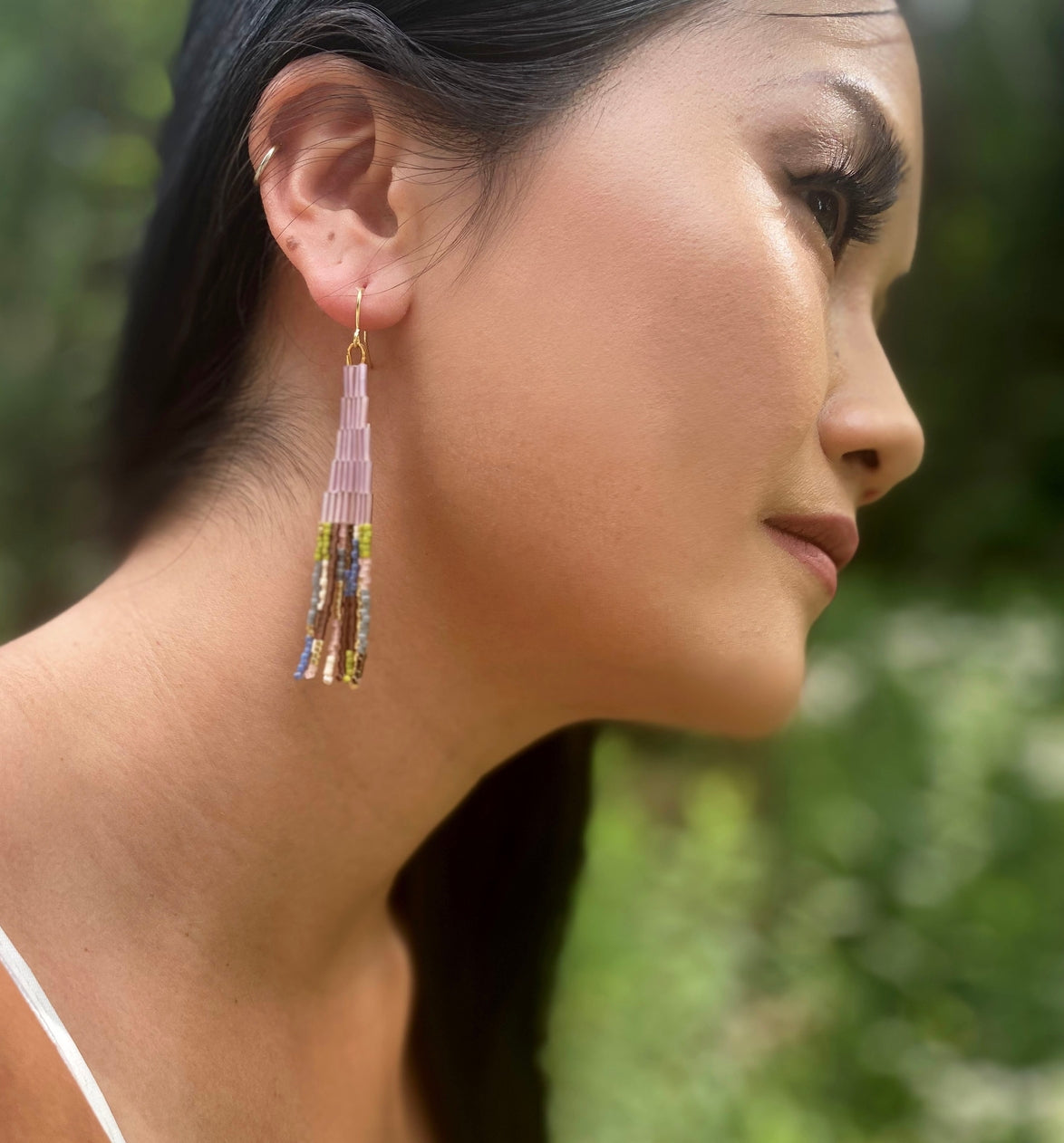 lilac garden handwoven beaded earrings on a model