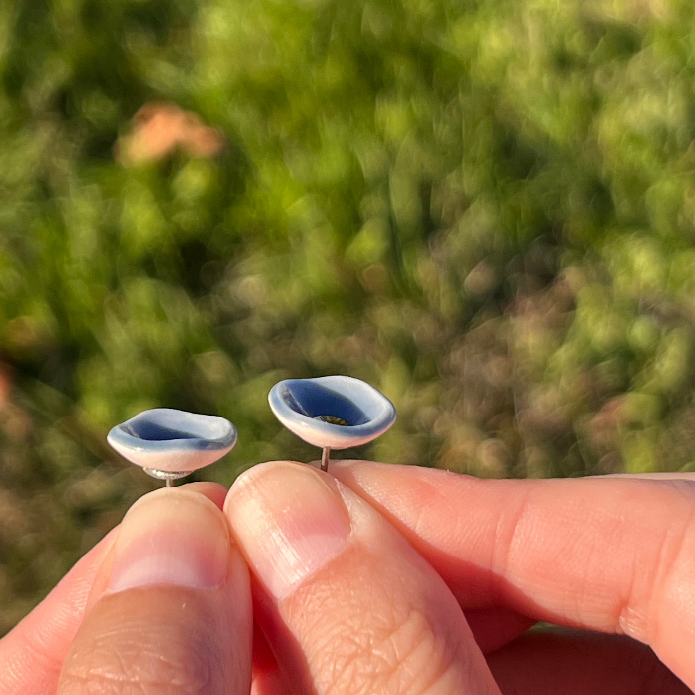 blue porcelain bowl stud earrings with gold centers side view