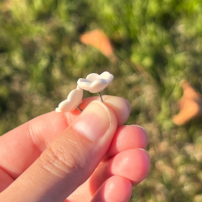 porcelain blossom stud earrings in white side view