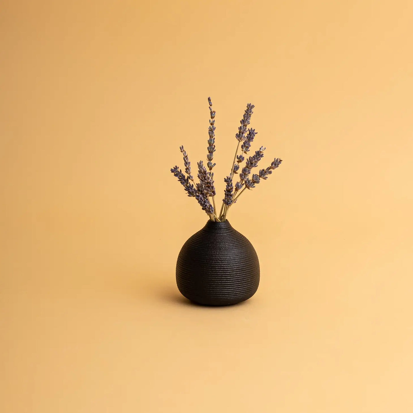 micro vase in black with lavender flowers