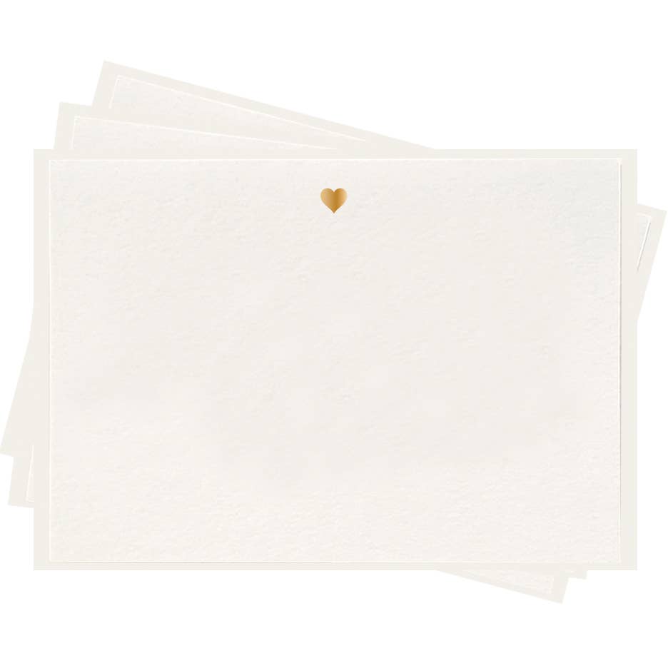 stack of white flat notes with a small gold foil heart top and center