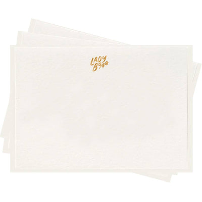 stack of white flat notes with small gold foil detailing that says lady boss