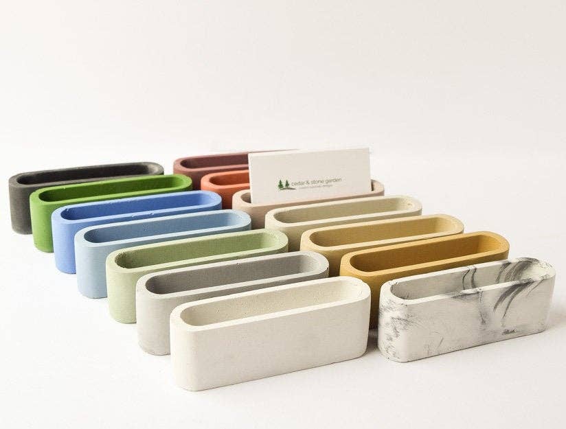 Colorful concrete business card holders, front view