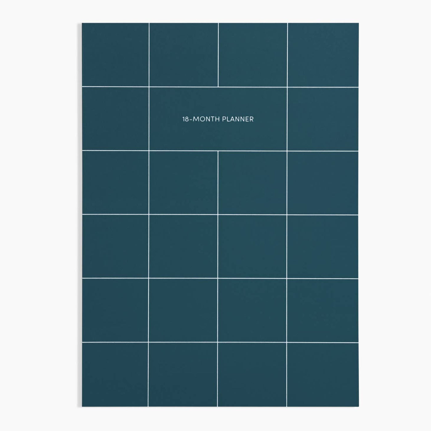 18-month planner front cover showing a white grid on a dark teal background