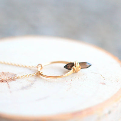 14k gold necklace with a pendant with a smokey quartz stone