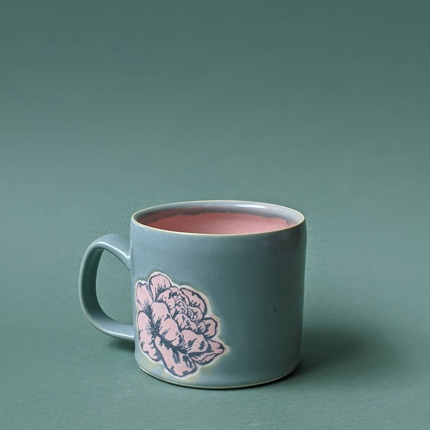 Pale blue mug with pink peony handcrafted on it
