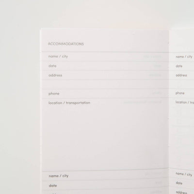 Sample interior page of travel journal showing accommodations prompts that include name/city, date, address, phone, and location/transportation.