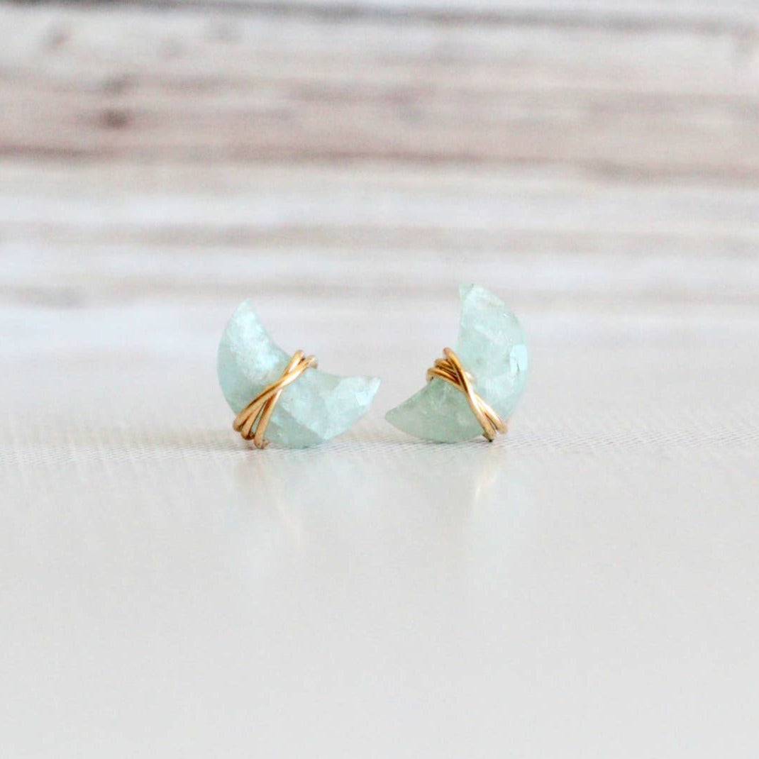 earring studs with aquamarine gemstones in a moon shape wrapped in 14k gold fill earring wire