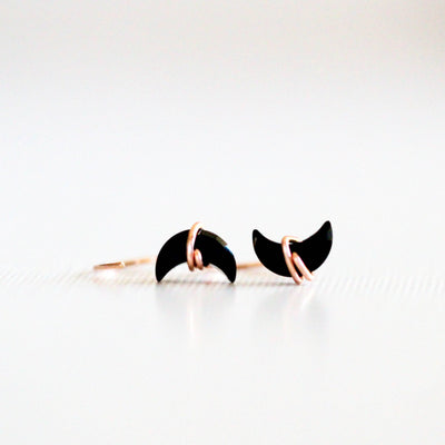 hug hoop earrings with black agate gemstones shaped like moons, wrapped in 14k rose gold fill earring wire