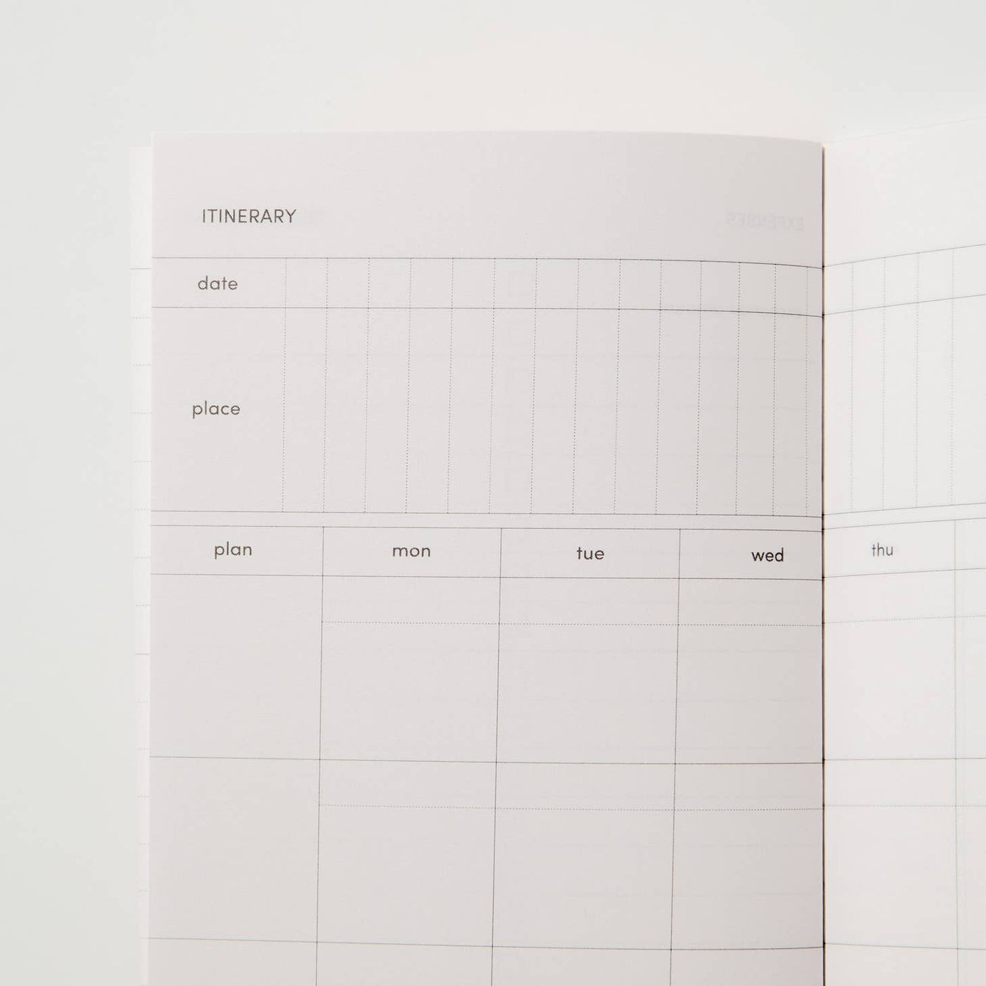 Sample interior page of travel journal showing itinerary with prompts for dates, places, and plans and a calendar grid view