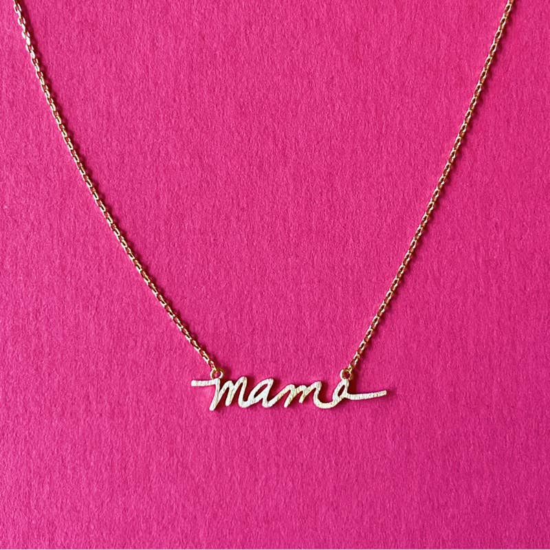 gold plated mama necklace on pink background