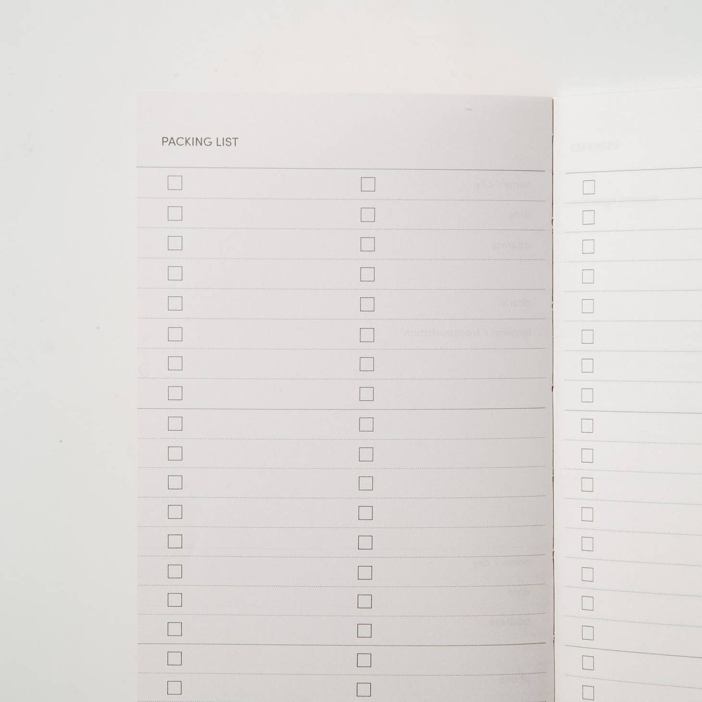 Sample interior page of travel journal showing packing list with a blank check box list
