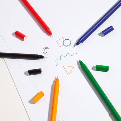 prism rollerball pens in various colors without caps, showing rollerball tips and samples of the pens writing on white paper