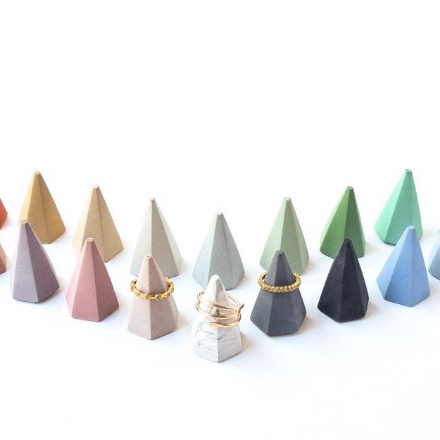 Different colored tiny hexagonal ring cones laid out with some rings on them