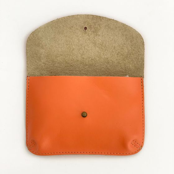 Coral color leather wallet, opened to reveal super soft unlined interior