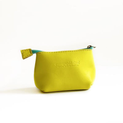 Leather coin pouch in bright yellow with a turquoise zipper; logo of maker pressed into leather in front center
